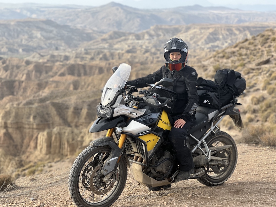 Lowered Tiger 900 Rally Pro riding off-road in the desert of Spain